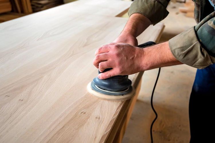 man-sanding-wood-with-orbital-sa.jpg